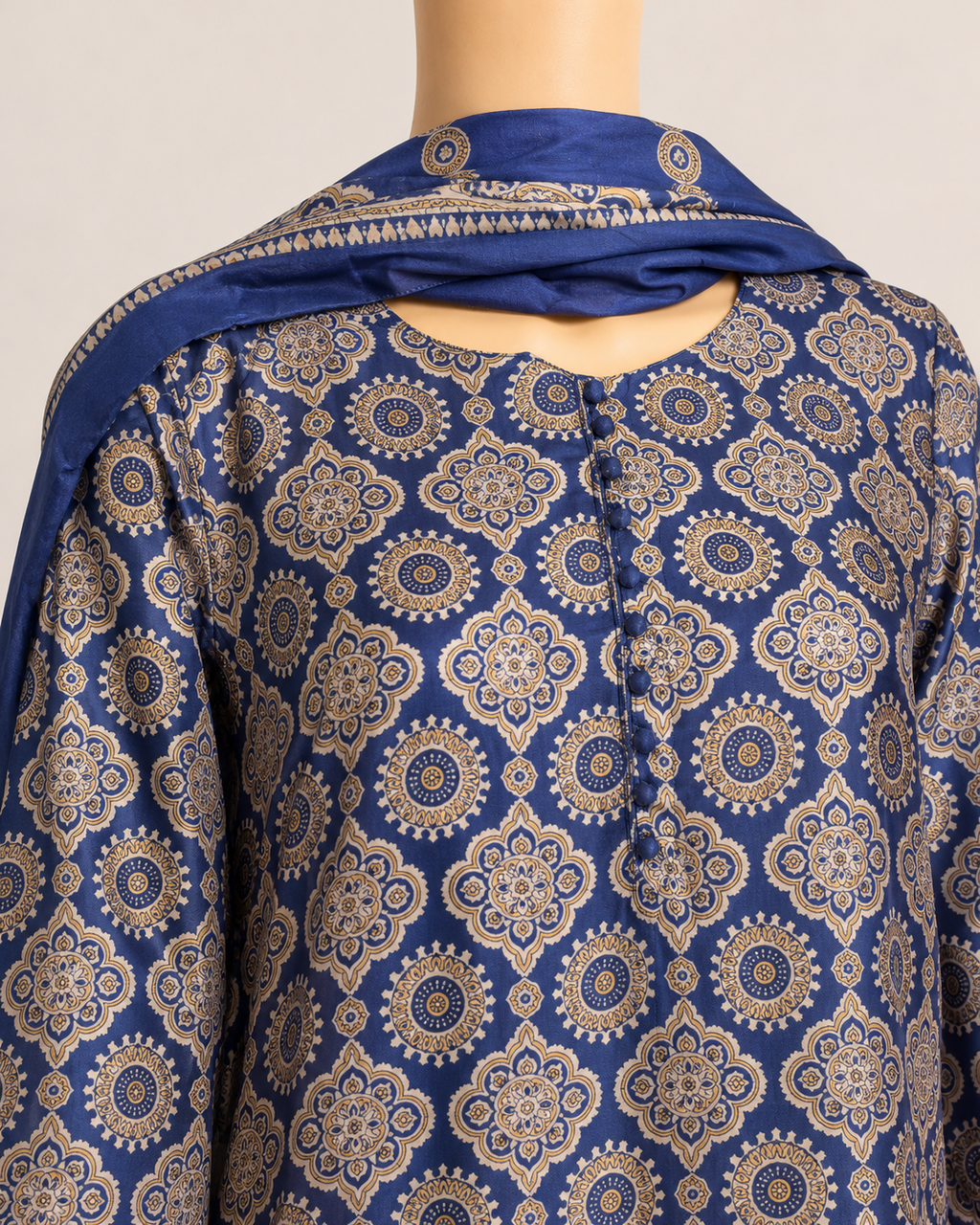 Close-up of BACTRA navy and beige medallion print with fabric-covered buttons