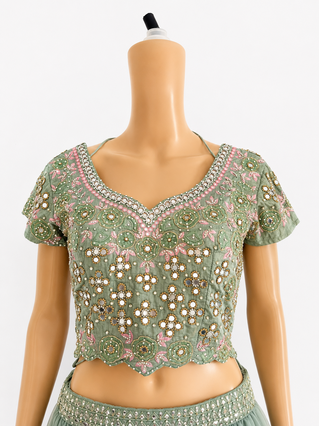 Front close-up of sage green embroidered mirrorwork blouse