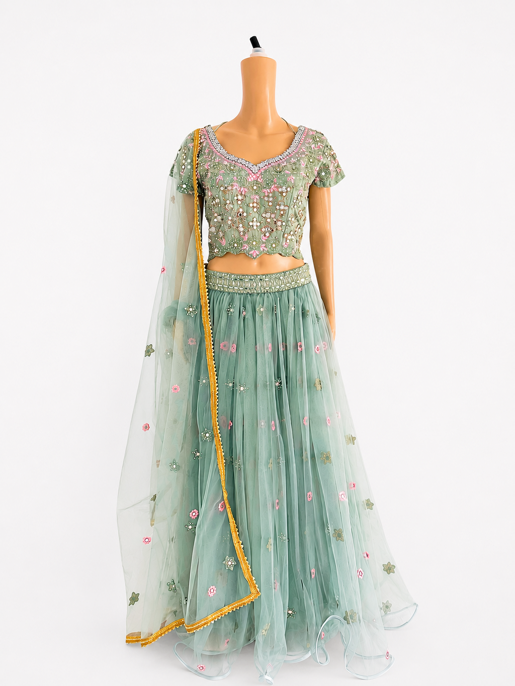 Front view of BACTRA sage green embroidered lehenga set on mannequin