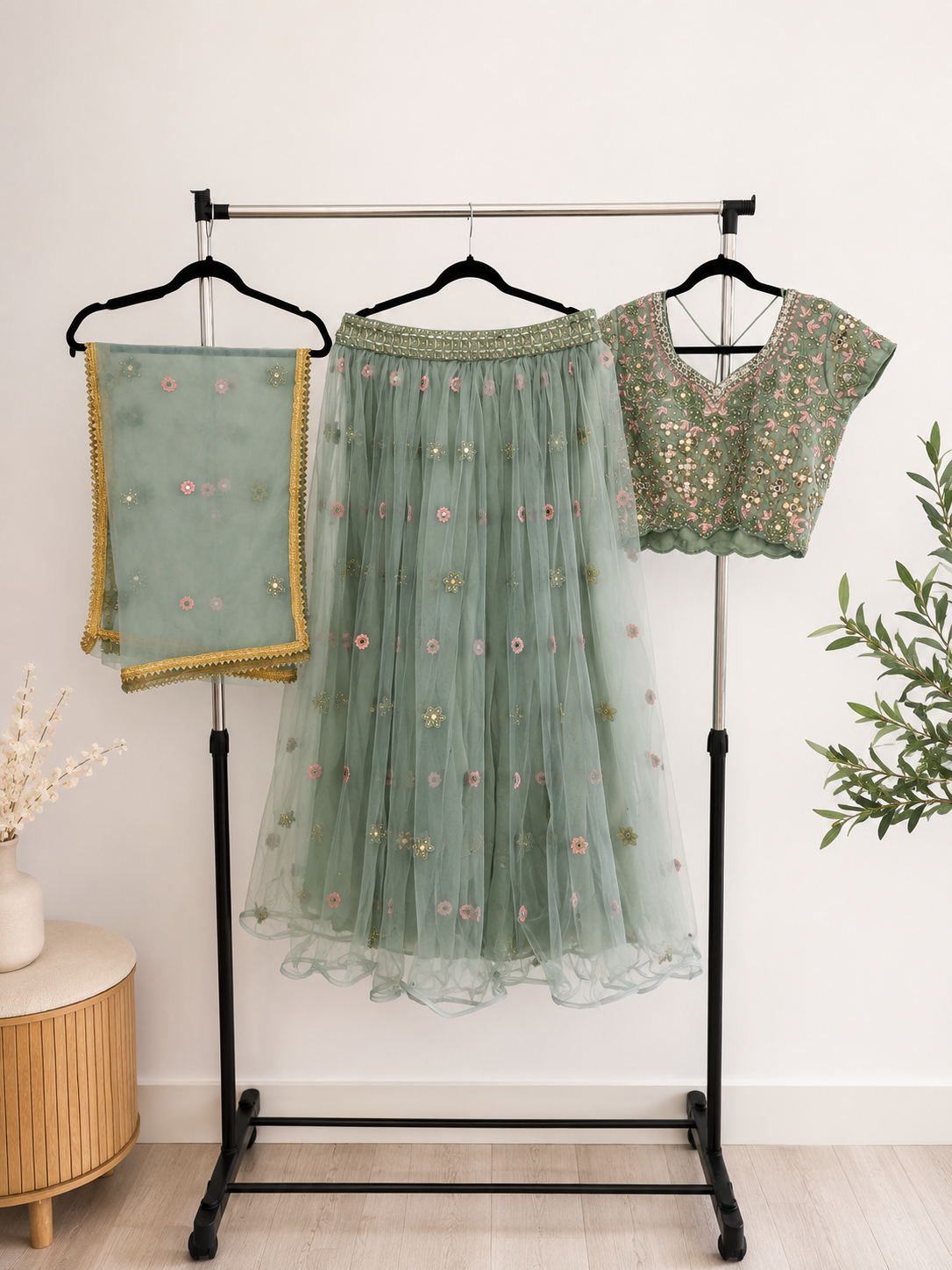 Sage green three-piece lehenga set with blouse, skirt and dupatta